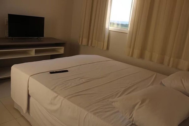 Apartamento Resort do Lago com roupas de cama